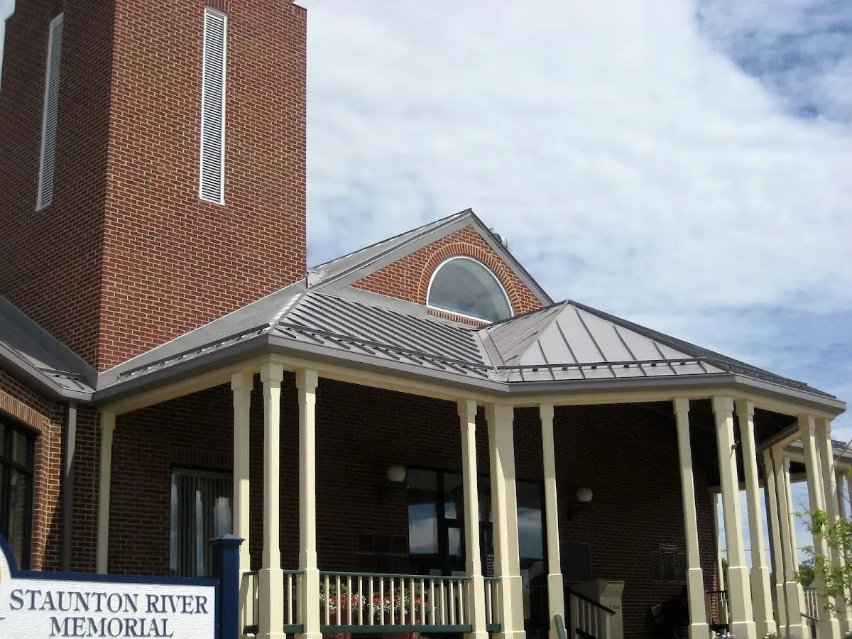 Skilled roofing craftsmen working on a residential roof in Cynthiana